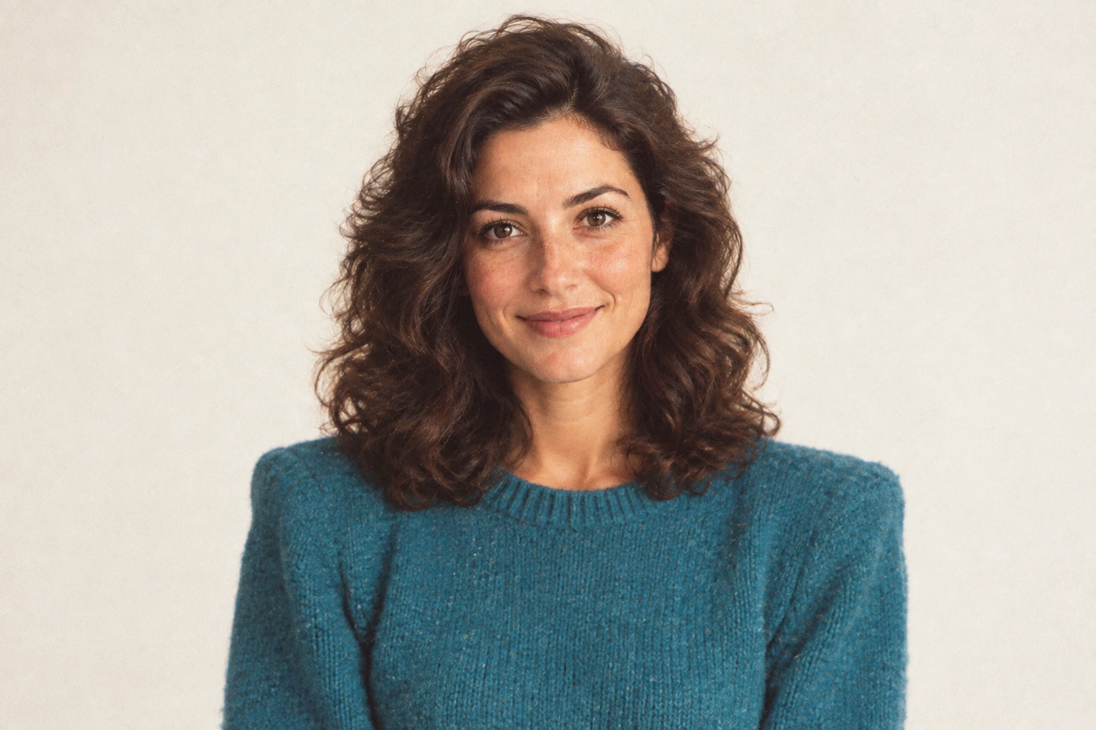 The same woman reimagined in a vintage 1980s studio portrait with period styling and soft film color.