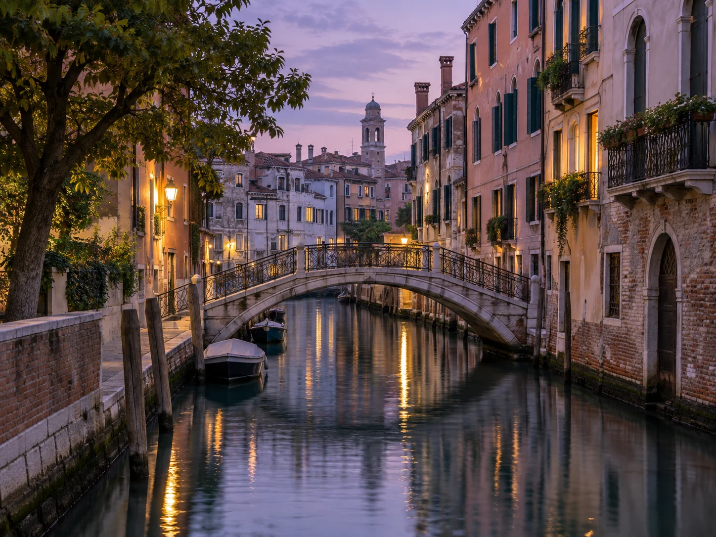 Original blue-hour photograph of a canal, arched bridge, and narrow European houses with warm window lights.