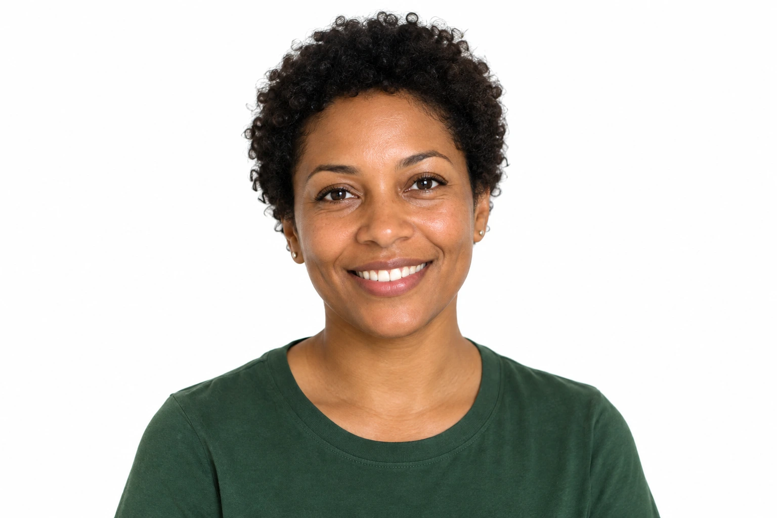 Close portrait of an adult woman with short curly hair in a contemporary green shirt against a white background.
